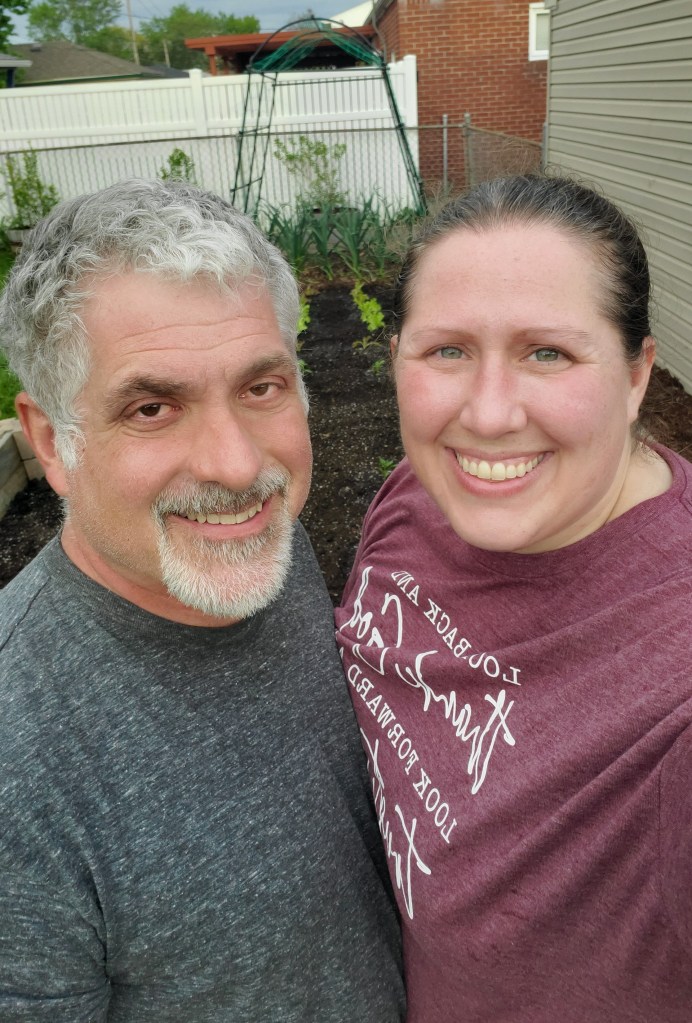 Joe and Becky in front of the garden