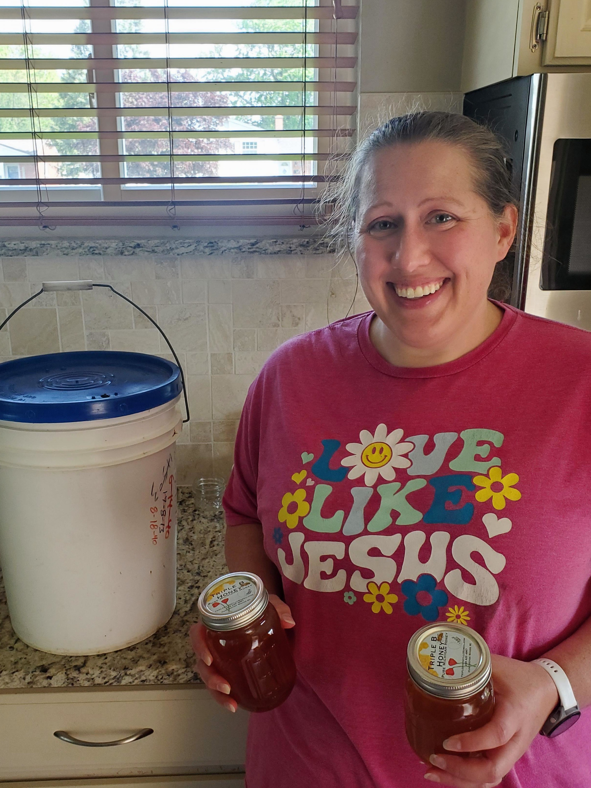 Becky and 60lbs of honey for Mother's Day gifts.
